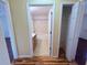 Hall bathroom with vanity sink, shower-tub combo, and access to storage closet at 1500 Fort Meade Pl, Poinciana, FL 34759