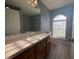 Bathroom featuring a large vanity, tile floors, and natural light at 1500 Fort Meade Pl, Poinciana, FL 34759