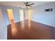Large bedroom with hardwood floors and multiple closets and bathroom access at 1500 Fort Meade Pl, Poinciana, FL 34759