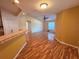 Living room with hardwood floors featuring a pass-through bar at 1500 Fort Meade Pl, Poinciana, FL 34759