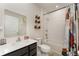 Bright bathroom featuring modern vanity, toilet, and shower-tub combination at 1336 Madison Cir, Haines City, FL 33844