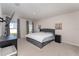 Spacious bedroom with neutral tones, natural light, a large bed, and contemporary decor at 1336 Madison Cir, Haines City, FL 33844