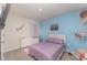Colorful bedroom with a playful aesthetic, soft lighting, and unique decor at 1336 Madison Cir, Haines City, FL 33844