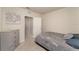 Well-lit bedroom with grey dresser, open door to closet, and neutral carpet at 1336 Madison Cir, Haines City, FL 33844