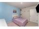 Bright bedroom with a comfortable bed, decor, and a calming color scheme at 1336 Madison Cir, Haines City, FL 33844