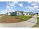 A cozy one-story home featuring well-maintained lawns and a two-car garage at 1336 Madison Cir, Haines City, FL 33844