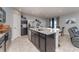 Well-equipped kitchen with stainless appliances, granite counters, and access to dining and living spaces at 1336 Madison Cir, Haines City, FL 33844