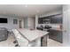 Stylish kitchen featuring granite countertops, stainless appliances, and a breakfast bar with seating at 1336 Madison Cir, Haines City, FL 33844