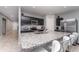 Modern kitchen with stainless steel appliances, granite countertops, and center island with seating at 1336 Madison Cir, Haines City, FL 33844