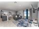 Spacious living area seamlessly blending a living room with a modern kitchen and dining area at 1336 Madison Cir, Haines City, FL 33844