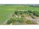 Aerial view of a home on a sprawling green lot, surrounded by mature trees and wide open spaces at 430 Alturas Babson Park Cutoff, Lake Wales, FL 33859