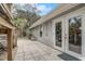 Back patio with stairs, and access to the backyard, and featuring double doors to the interior at 430 Alturas Babson Park Cutoff, Lake Wales, FL 33859