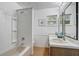 Well-lit bathroom showcasing a dual vanity and a shower-tub combination at 430 Alturas Babson Park Cutoff, Lake Wales, FL 33859