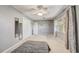 Bedroom with neutral tones, ceiling fan, and large window at 430 Alturas Babson Park Cutoff, Lake Wales, FL 33859