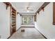 Bright living room featuring hardwood floors, built-in shelves, and a large window providing ample natural light at 430 Alturas Babson Park Cutoff, Lake Wales, FL 33859