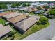 Home featuring a well-kept lawn and mature trees adding to the property's curb appeal in a suburban neighborhood at 622 Jamaica Cir, Lakeland, FL 33803
