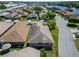 Home with a well-maintained roof and lawn on a tree-lined street showcasing the property's exterior appeal at 622 Jamaica Cir, Lakeland, FL 33803