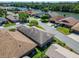 Property featuring a well-maintained roof and landscaping with mature trees, showcasing the exterior at 622 Jamaica Cir, Lakeland, FL 33803