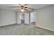 Bedroom featuring green carpet, ceiling fan, and access to other rooms at 622 Jamaica Cir, Lakeland, FL 33803