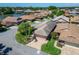 Inviting single-story home with a brick-paved driveway, mature landscaping, and a serene lakeside view at 622 Jamaica Cir, Lakeland, FL 33803