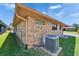 Back view of a brick home with AC unit at 622 Jamaica Cir, Lakeland, FL 33803