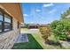 Brick home exterior with green lawn and tropical foliage at 622 Jamaica Cir, Lakeland, FL 33803