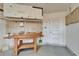 Garage with pegboard, storage, and craftsman workbench at 622 Jamaica Cir, Lakeland, FL 33803