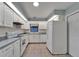 Bright kitchen with white appliances, tile floor and ample counter space at 622 Jamaica Cir, Lakeland, FL 33803