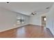 Living area showing laminate floors, a ceiling fan, and view into an adjacent room at 622 Jamaica Cir, Lakeland, FL 33803