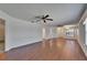 Spacious living room with hardwood floors, ceiling fan and abundant natural light at 622 Jamaica Cir, Lakeland, FL 33803