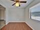 Room with wood flooring, ceiling fan, and window at 622 Jamaica Cir, Lakeland, FL 33803