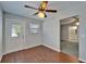Room with wood flooring, ceiling fan, and door at 622 Jamaica Cir, Lakeland, FL 33803