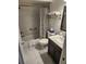 Full bathroom with a shower-tub combo and a vanity with a dark wood cabinet at 8212 Borgia Ct, Orlando, FL 32836
