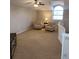 Cozy loft area with carpeting, a large window, and space for a sitting area, perfect for relaxing at 8212 Borgia Ct, Orlando, FL 32836
