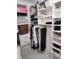 Walk-in closet with custom shelving, providing ample storage space for clothes, shoes, and accessories at 8212 Borgia Ct, Orlando, FL 32836