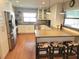 Modern kitchen with stainless steel appliances, light cabinets, and barstool seating at the counter at 8212 Borgia Ct, Orlando, FL 32836