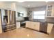 Well-appointed kitchen with stainless appliances, white cabinets, and a stylish backsplash at 8212 Borgia Ct, Orlando, FL 32836