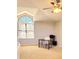 Bright home office with large window, desk, chair, and neutral carpeting at 8212 Borgia Ct, Orlando, FL 32836