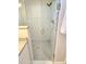 The bathroom features a glass-enclosed shower with tiled walls and a showerhead at 8212 Borgia Ct, Orlando, FL 32836