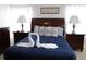 Comfortable bedroom featuring a queen bed, swan towel art, and side tables at 151 Pompano Beach Dr, Kissimmee, FL 34746