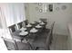 Elegant dining room with seating for eight and decorative wall accents at 151 Pompano Beach Dr, Kissimmee, FL 34746