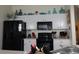 Well-appointed kitchen with white cabinets and modern black appliances at 151 Pompano Beach Dr, Kissimmee, FL 34746