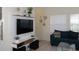 Stylish living room with modern furniture and ample natural light at 151 Pompano Beach Dr, Kissimmee, FL 34746