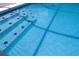 Pool close-up showcasing the clear water, steps, tile, and tranquil ambiance at 151 Pompano Beach Dr, Kissimmee, FL 34746