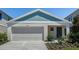 Charming single-story home featuring a two-car garage and a welcoming entryway at 1772 Frogmore Ave, Haines City, FL 33844