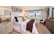 Cozy bedroom featuring carpet, natural light, and warm neutral colors at 1034 Foreshore Ln, Haines City, FL 33844