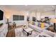 Comfortable living room with modern furniture, light-colored walls and wood flooring at 1034 Foreshore Ln, Haines City, FL 33844