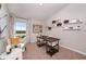 Well-lit home office featuring a work desk, shelving, and a window overlooking the lush outdoors at 1034 Foreshore Ln, Haines City, FL 33844