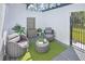 Outdoor patio with modern seating, a water feature, and artificial turf for a relaxing ambiance at 1829 Adrian Creek Blvd, Port Orange, FL 32128