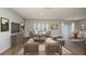 Spacious living room with wood flooring, neutral paint, recessed lighting and a sliding glass door to the exterior at 4047 Gardenia Ave, Lake Hamilton, FL 33851